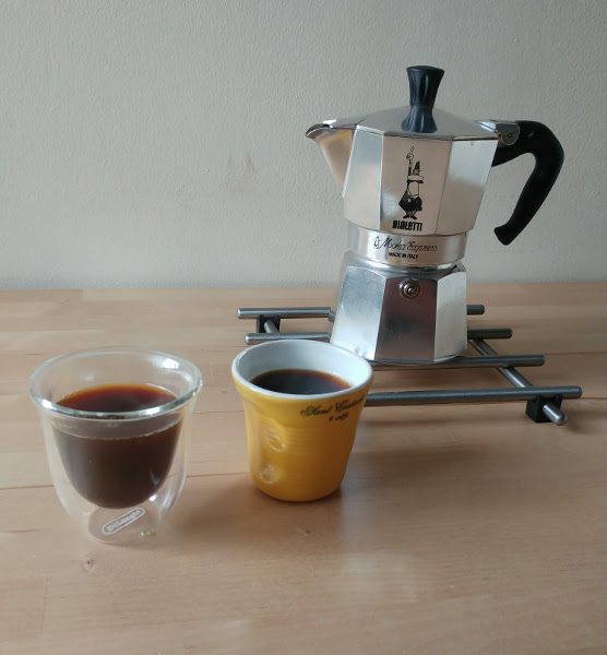 Moka Pot with espresso cups of coffee